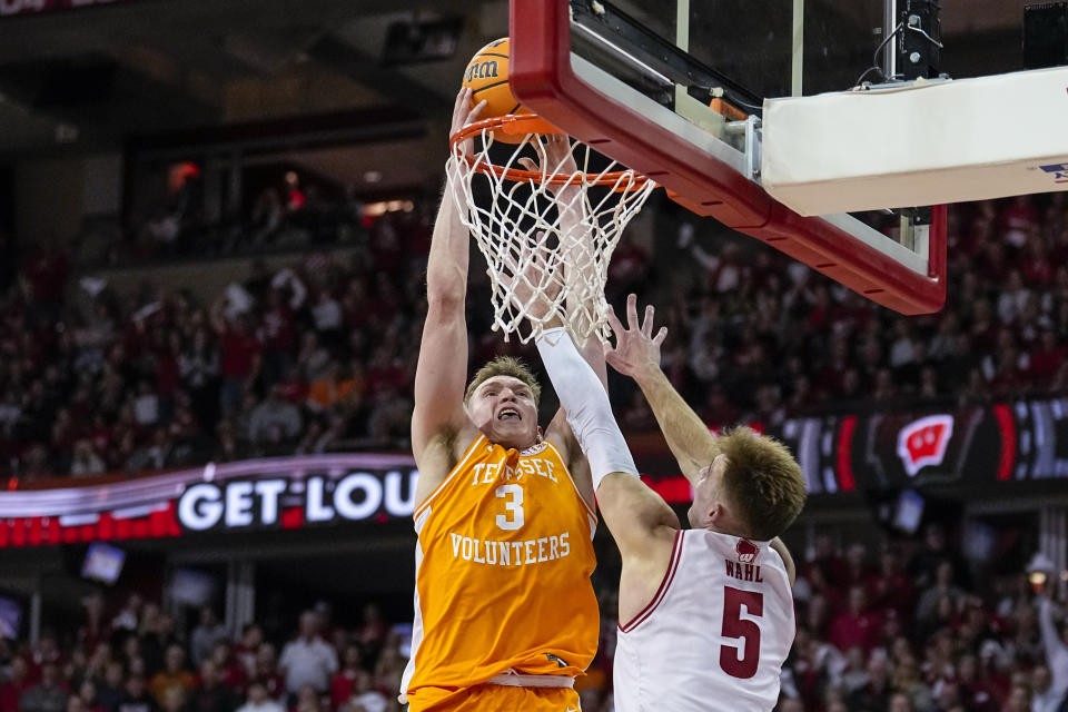 Tennessee's Dalton Knecht (3) goes up to dunk against Wisconsin's Tyler Wahl (5) during the first half of an NCAA college basketball game Friday, Nov. 10, 2023, in Madison, Wis. (AP Photo/Andy Manis)