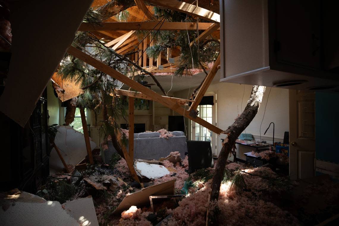 Tornado damage to Joy and John Bashore’s living room in Rocky Mount, N.C. is shown on Thursday, July 20, 2023. A tornado swept through the area on Wednesday, with several trees falling on the roof of the Bashore’s residence. Joy said she was inside the house with her dog when the tornado hit, and waited in the hallway until the storm passed. Neither Joy nor her dog were injured.