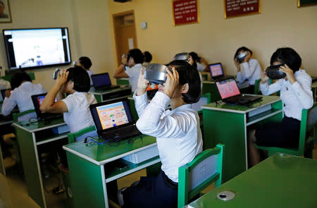 Students use VR glasses during a class at a teachers' training college during a government organised visit for foreign reporters ahead of the 70th anniversary of North Korea's foundation, in Pyongyang, September 7, 2018. REUTERS/Danish Siddiqui