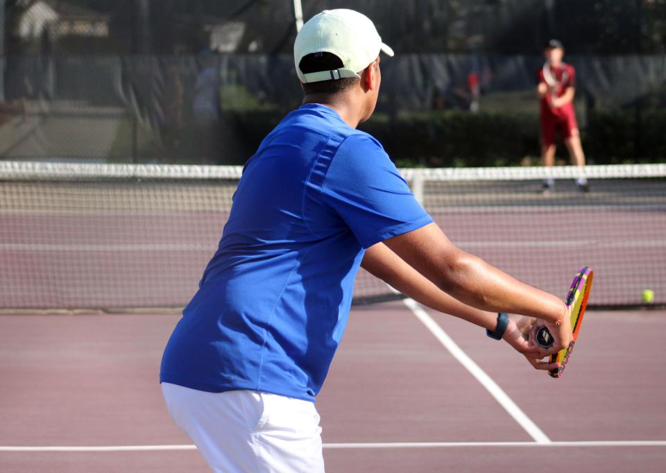 Bolles' Dhruv Pandya prepares to serve against Episcopal's Ford Rachels during a 2023 match.