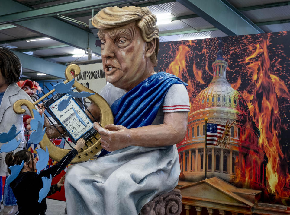 A figure depicting US President Donald Trump is shown during a press preview for the Mainz carnival, in Mainz, Germany, Tuesday, Feb. 18, 2020. (AP Photo/Michael Probst)