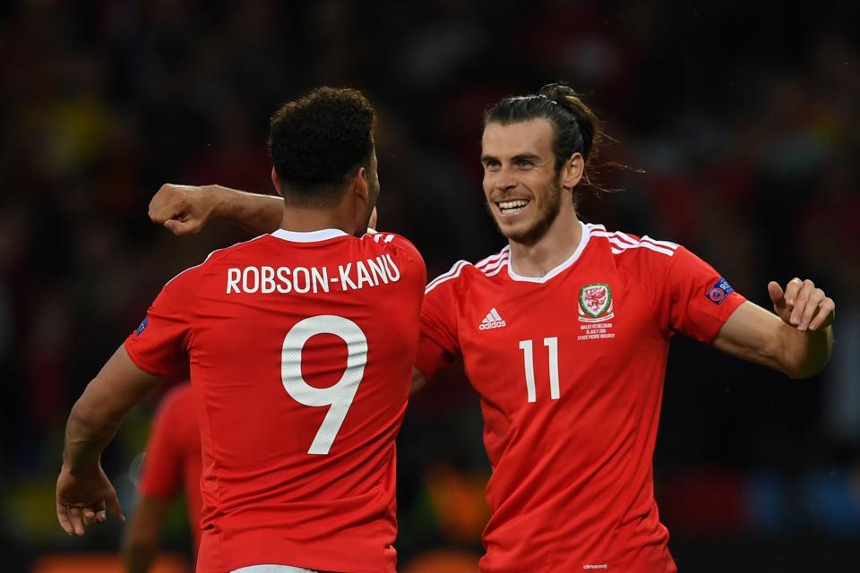 Wales' forward Hal Robson-Kanu (L) celebrates after scoring a goal with Wales' forward Gareth Bale (R) during the Euro 2016 quarter-final football match between Wales and Belgium at the Pierre-Mauroy stadium in Villeneuve-d'Ascq near Lille, on July 1, 2016. / AFP / PAUL ELLIS        (Photo credit should read PAUL ELLIS/AFP via Getty Images)