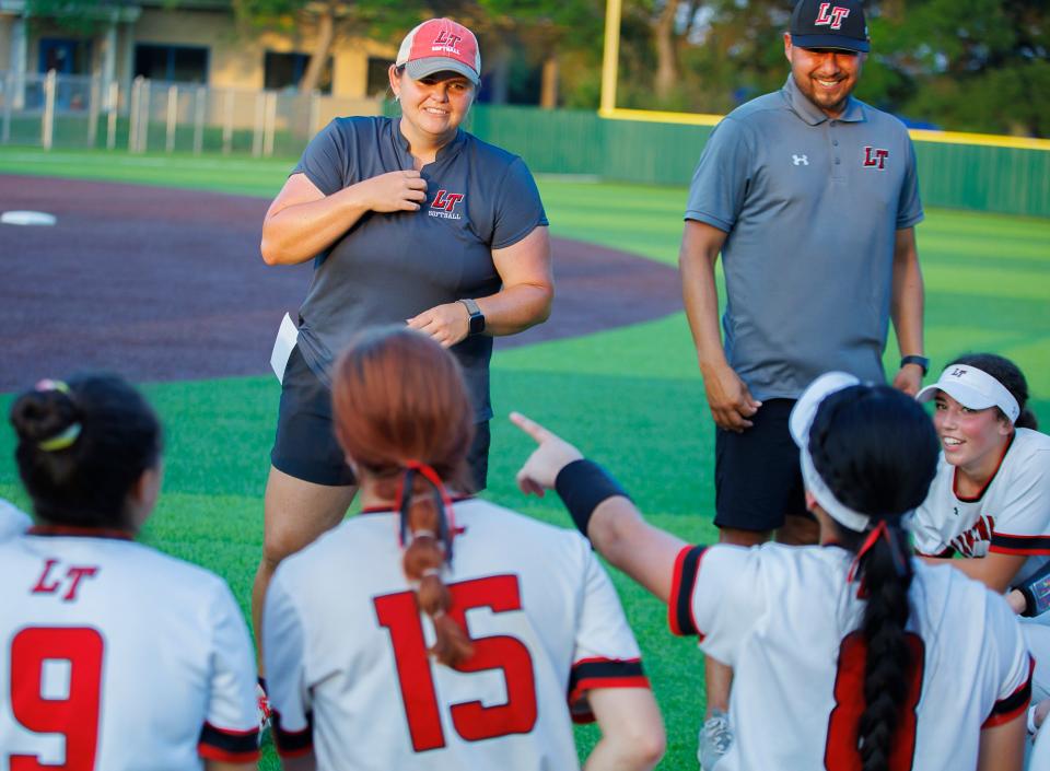 Lake Travis softball coach Kaycee Taylor, speaking to her team after a 2022 playoff victory, will lead the Cavaliers into the Region IV-6A semifinals next week after Friday night's 2-1 win over District 26-6A rival Bowie in the regional quarterfinals.