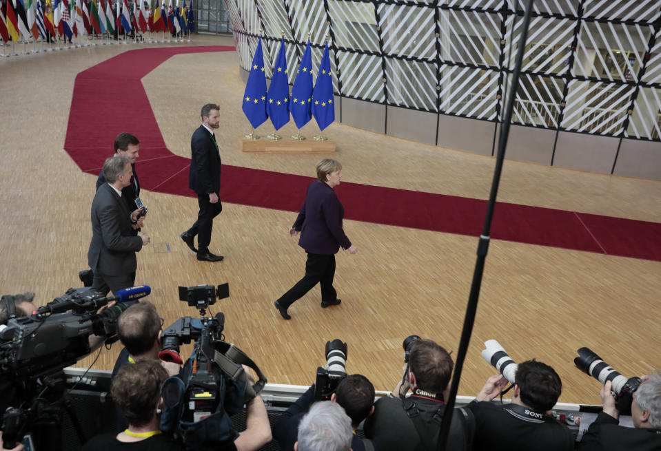 German Chancellor Angela Merkel arrives for an EU summit at the European Council building in Brussels, Thursday, Feb. 20, 2020. After almost two years of sparring, the EU will be discussing the bloc's budget to work out Europe's spending plans for the next seven years. (AP Photo/Virginia Mayo)