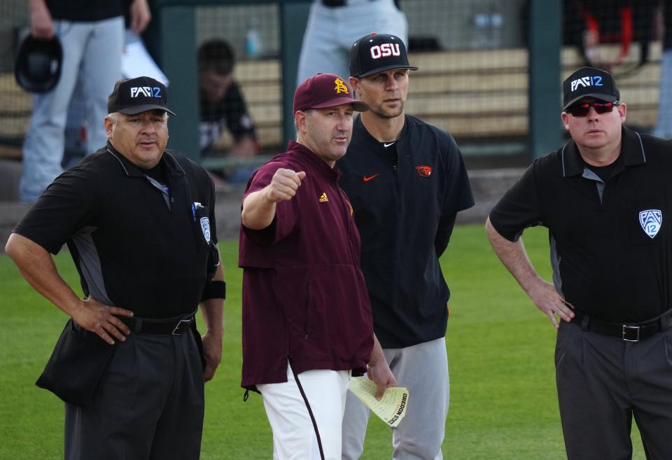 April 21, 2023; Phoenix, Ariz.; USA; ASU head coach Willie Bloomquist talks with the umpires prior to a game against Oregon State at Phoenix Municipal Stadium.