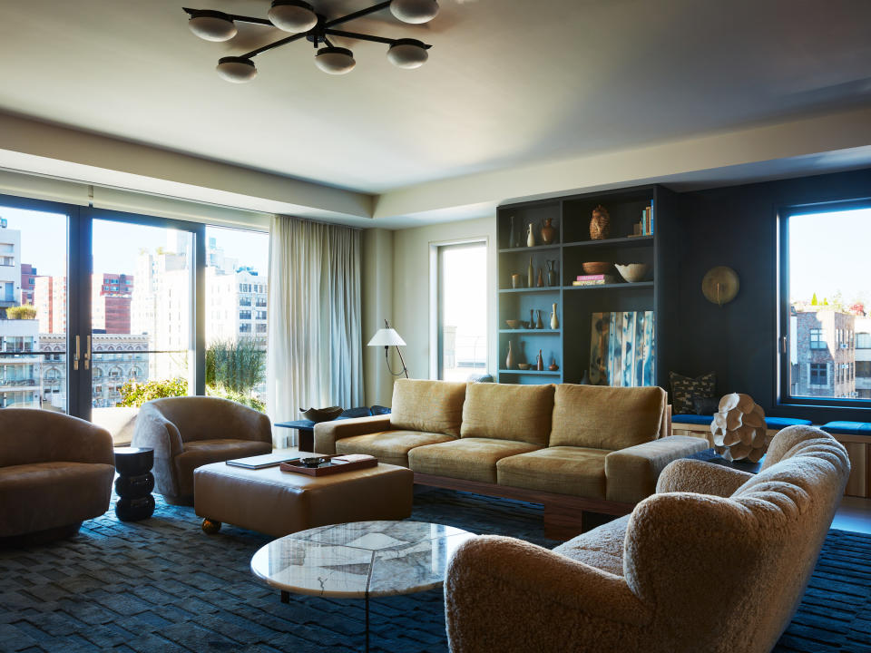 A living room with a brown sofa