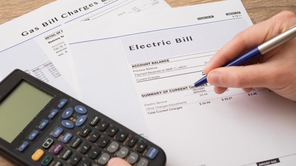 Electric bill charges paper form on the table