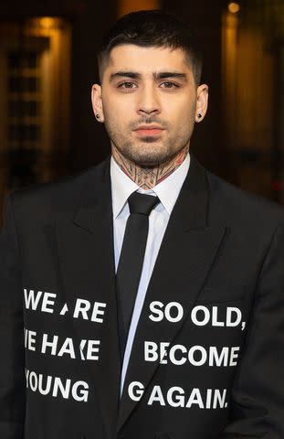 <p>Marc Piasecki/WireImage</p> Zayn Malik attends the Valentino Menswear Fall/Winter 2024 on Jan. 20