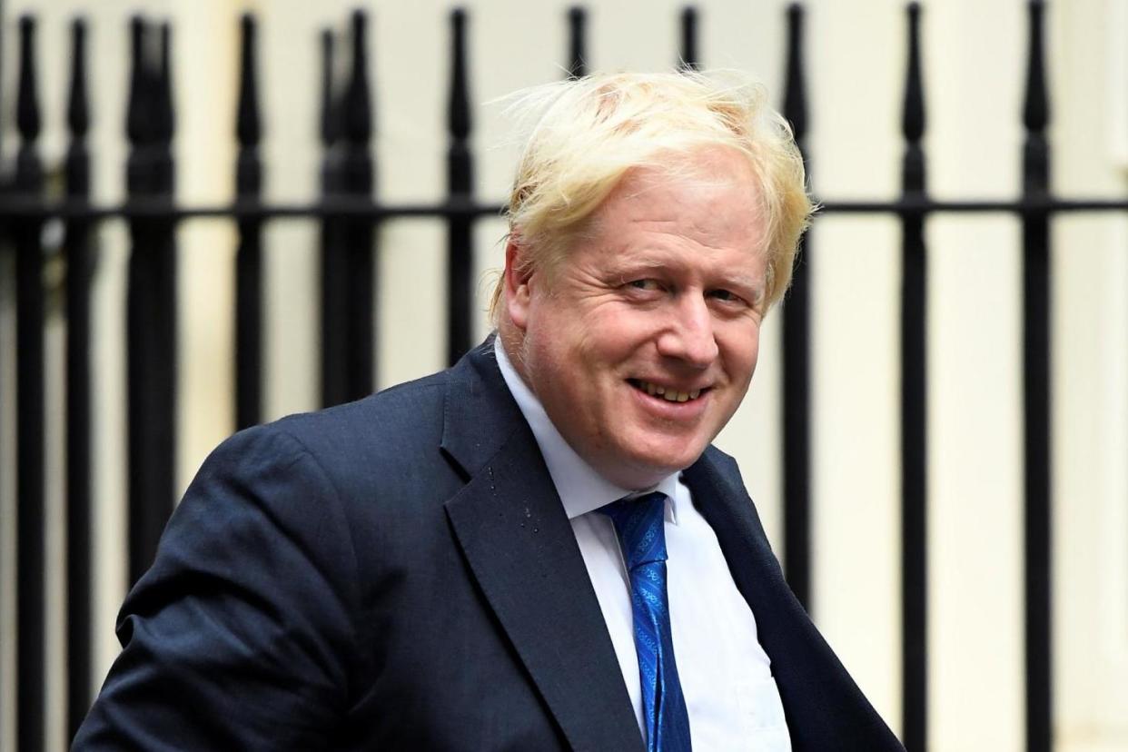 Sticking to the task: Foreign Secretary Boris Johnson on his way to Number 10 after flying back overnight from New York: REUTERS