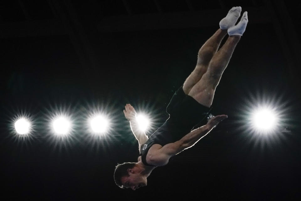 Dylan Schmidt, of New Zealand, competes in the in the men's trampoline gymnastics qualifier at the 2020 Summer Olympics, Saturday, July 31, 2021, in Tokyo. (AP Photo/Ashley Landis)