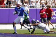 SMU wide receiver Rashee Rice (11) scores a touchdown in front of TCU safety T.J. Carter (7) during the second half of an NCAA football game in Fort Worth, Texas, Saturday, Sept. 25, 2021. (AP Photo/Michael Ainsworth)