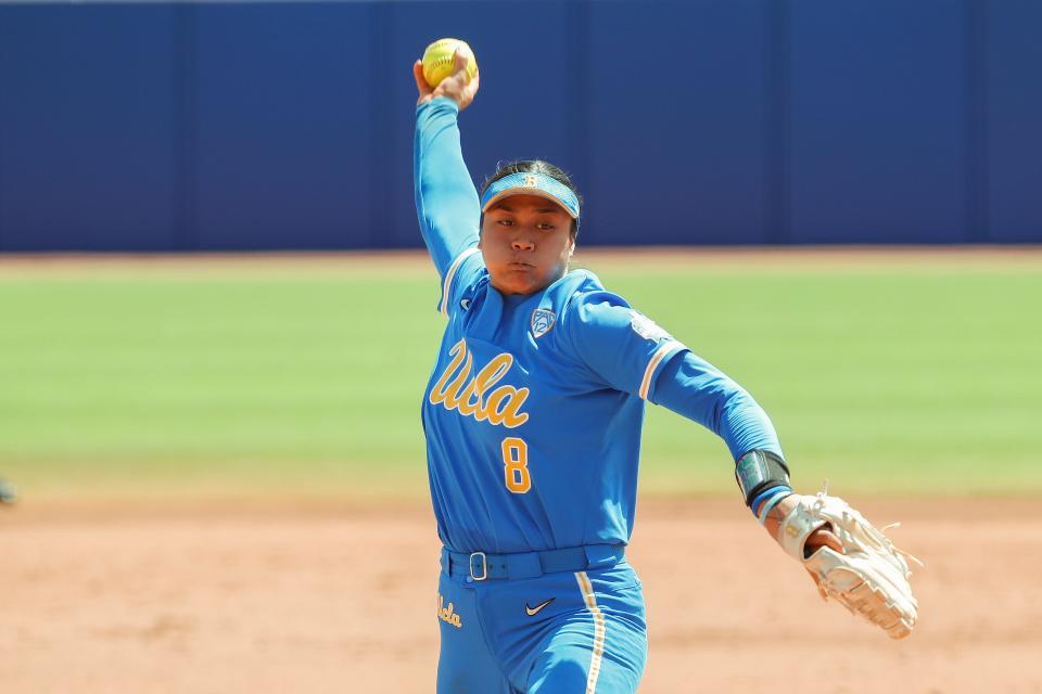 FILE - UCLA's Megan Faraimo pitches in the first inning of an NCAA softball Women's College World Series game against Oklahoma, in Oklahoma City on June 6, 1992. UCLA, which beat Oklahoma for the title in 2019 and reached the semifinals last season, is ready to challenge. Faraimo is one of the nation’s best pitchers, and the Bruins have the bats to back her up. (AP Photo/Alonzo Adams, File)