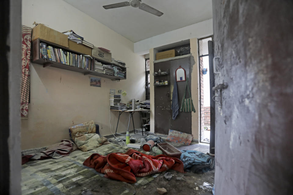 A hostel room vandalized after Sunday's assault by masked assailants at the Jawaharlal Nehru University in New Delhi, India, Monday, Jan. 6, 2020. More than 20 people were injured in the attack opposition lawmakers are trying to link to the government. (AP Photo/Altaf Qadri)