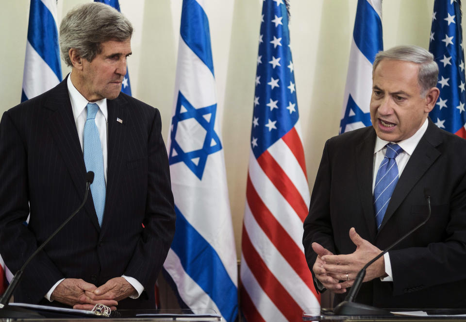 FILE - In this Jan. 2, 2014 file photo, U.S. Secretary of State John Kerry, left, listens as Israeli Prime Minister Benjamin Netanyahu makes a statement during a press conference before their talk at the prime minister's office in Jerusalem. Nine months of U.S.-driven diplomacy have left Israelis and Palestinians less hopeful than ever about a comprehensive peace agreement to end their century of conflict. Although a formula may yet be found to somehow prolong the talks past an end-of-April deadline, they are on the brink of collapse and the search is already on for new ideas. (AP Photo/Brendan Smialowski, Pool, File)