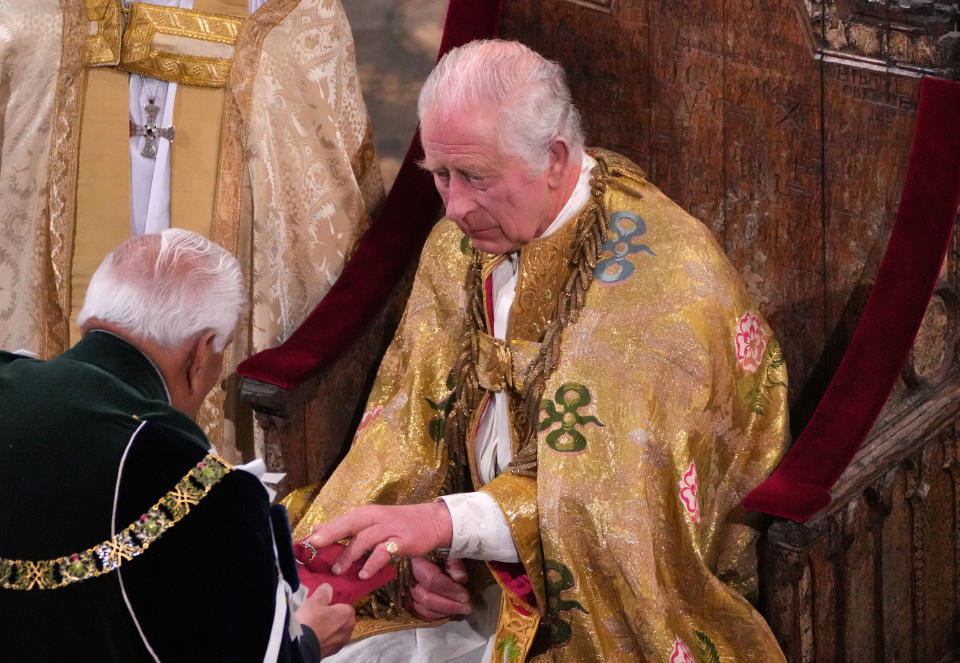 LONDON, ENGLAND - MAY 06: King Charles III holds the Sovereign's Ring, also called the Coronation Ring, during his coronation ceremony in Westminster Abbey on May 6, 2023 in London, England. The Coronation of Charles III and his wife, Camilla, as King and Queen of the United Kingdom of Great Britain and Northern Ireland, and the other Commonwealth realms takes place at Westminster Abbey today. Charles acceded to the throne on 8 September 2022, upon the death of his mother, Elizabeth II. (Photo by Aaron Chown  - WPA Pool/Getty Images)