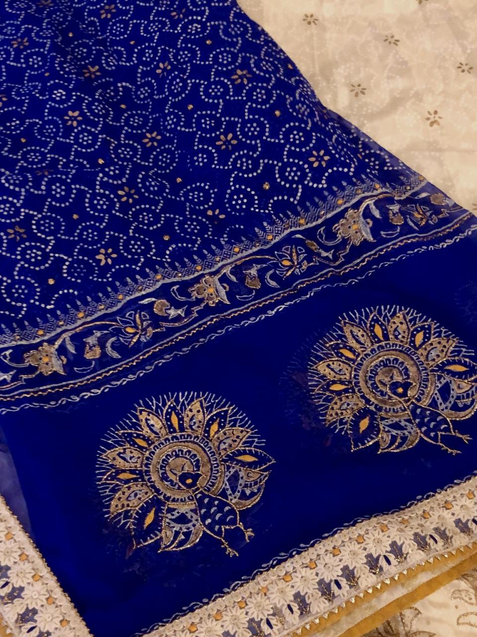 Perahan is renowned for detailed dupatta designs. This royal blue dupatta is embellished with peacock motifs. 