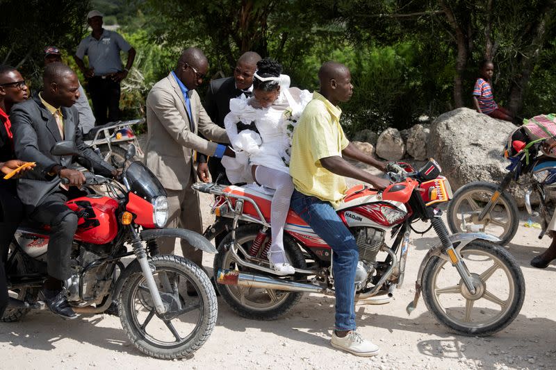 The Wider Image: Haiti's brides beat hurricanes, power cuts and protests to wed in style