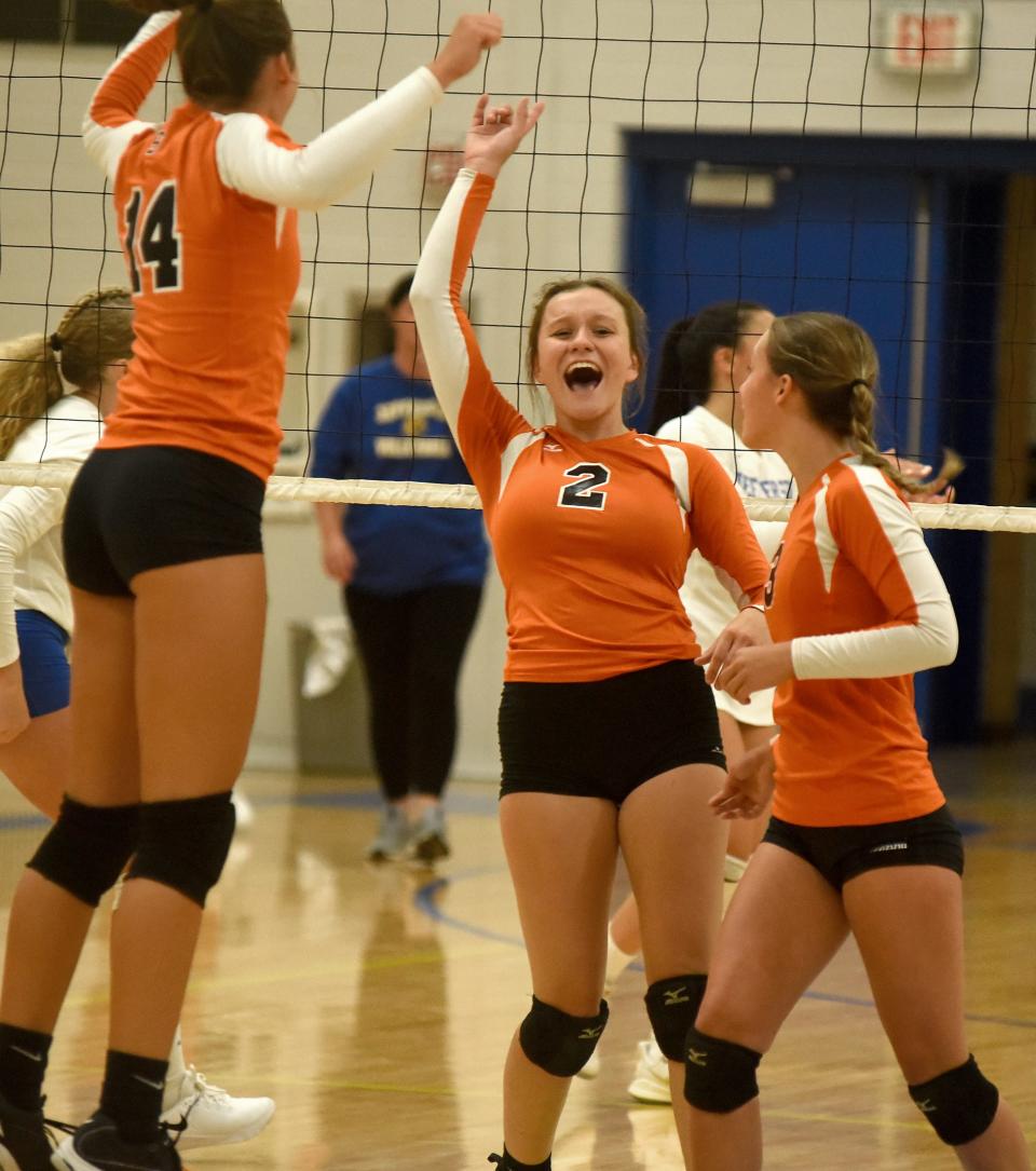 Summerfield's Julia Fietz (center) celebrates with teammates Faith Secor and Addison Ciacelli Wednesday against Jefferson Wednesday. Summerfield won in five sets.