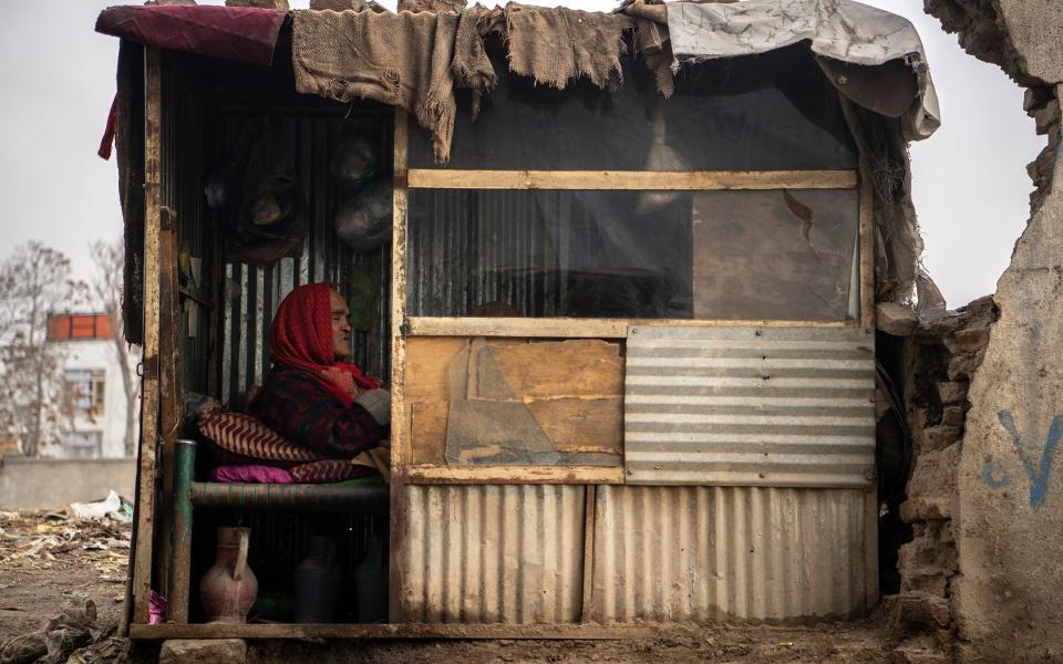 A poor man rests at his own place in Kabul down town, Afghanistan - Massoud Hossaini /  WFP Afghanistan