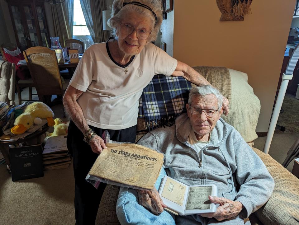 Juanita and Ned Robinett show a copy of The Stars and Stripes, Mediterranean edition, and Ned Robinett’s V-mail letters to family during WWII. He is the oldest living veteran in Sandusky County at 100.