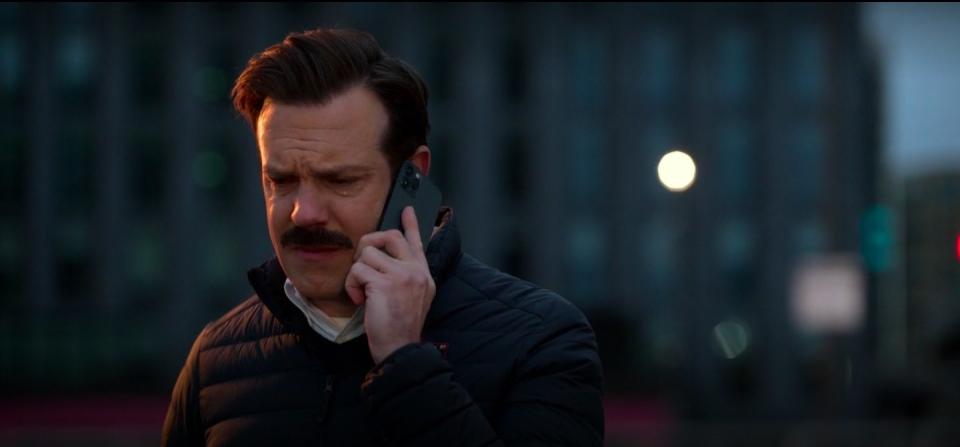 Ted on the phone in "Ted Lasso."