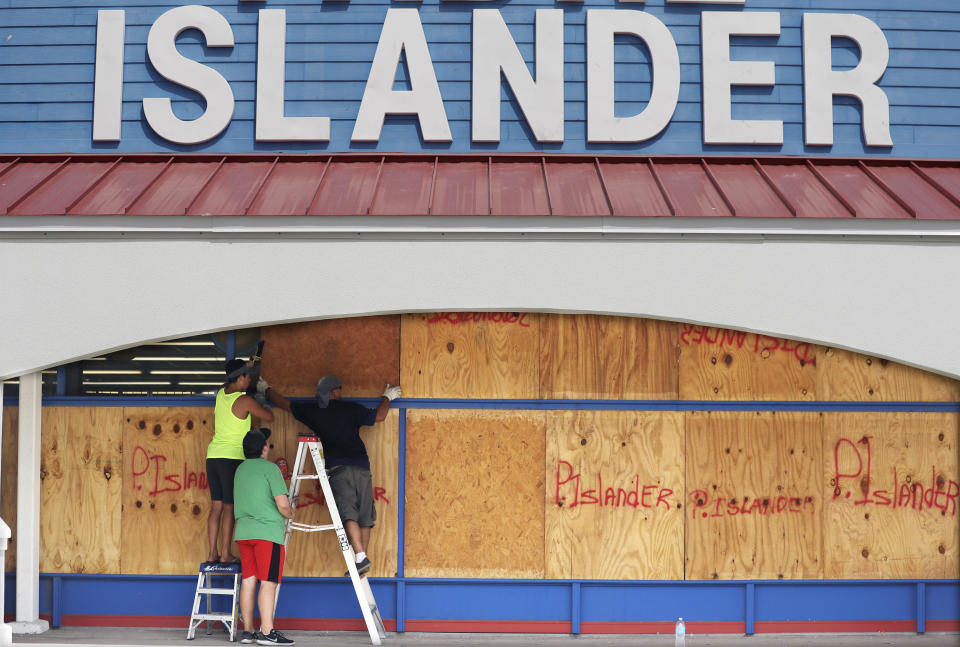 <p>Workers cover a business with plywood in preparation for Hurricane Harvey, Thursday, Aug. 24, 2017, in Corpus Christi, Texas. (AP Photo/Eric Gay) </p>