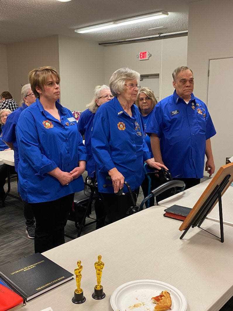 Three members of the Michigan Auxiliary to the Veterans of Foreign Wars of Michigan were installed as new officers at a ceremony April 13. They included (front row, from left): Angela Wood, senior vice president; Dawn Shock from Erie, president; and Patrick Rich, junior vice president.