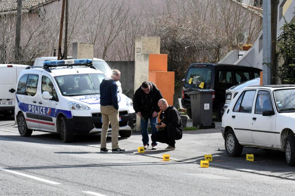 Police officers secure evidence during the police operation near Trebes (EPA)