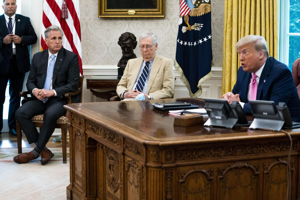 WASHINGTON, DC - JULY 20: U.S. President Donald Trump (R) talks to reporters while hosting House Minority Leader Kevin McCarthy (R-CA) (2nd L), Senate Majority Leader Mitch McConnell (R-KY) and members of Trump's cabinet in the Oval Office at the White House July 20, 2020 in Washington, DC. Trump and the congressional leaders talked about a proposed new round of financial stimulus to help the economy during the ongoing global coronavirus pandemic.  (Photo by Doug Mills/Getty Images)