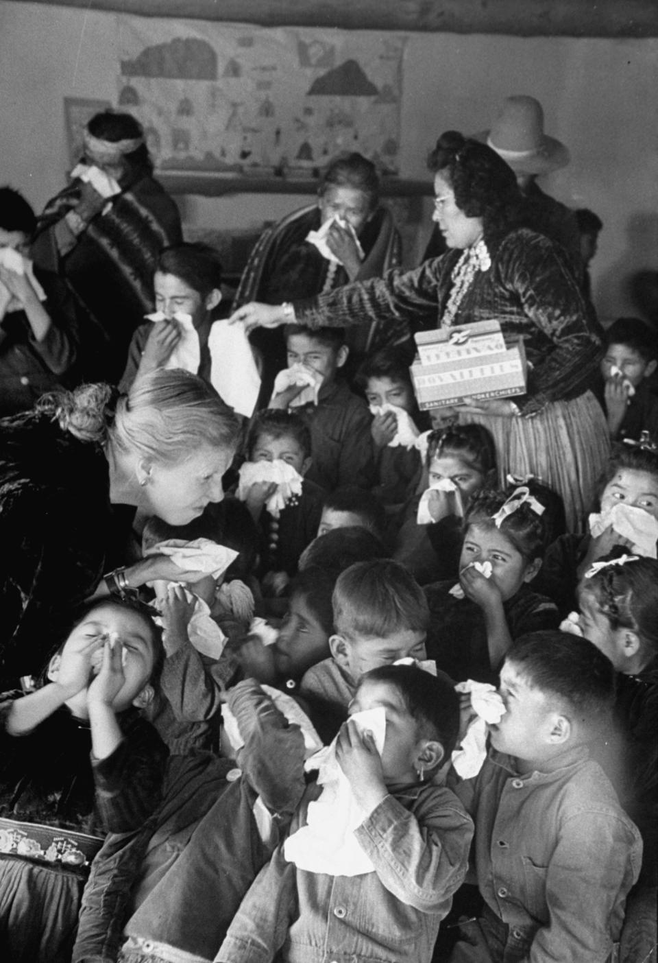 <b>Caption from LIFE.</b> Navajo schoolchildren get a lesson in nose blowing from white teacher.