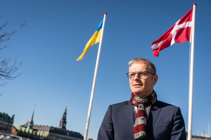 Flemming Moller Mortensen, Danish Minister for Development Aid hoists the Ukrainian flag, in Copenhagen