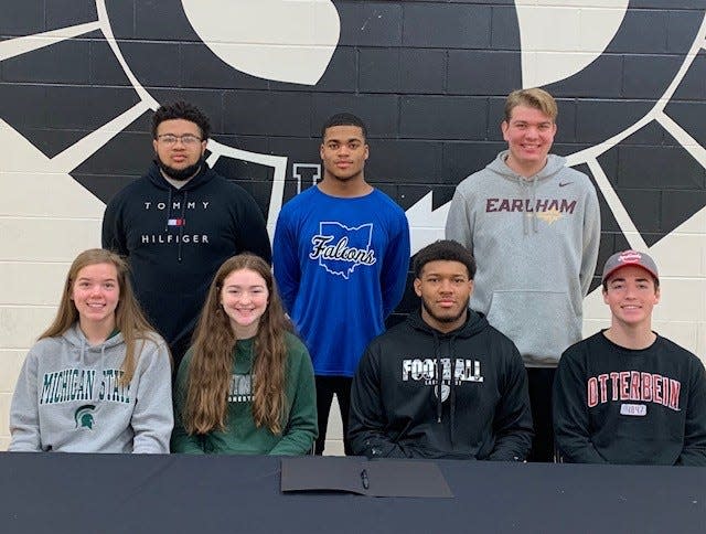 Lakota East athletes who signed their letters of intent to play college sports Feb. 2 were, from left: back, Greg Roberson, Ashland University football; Nathan Rosario-Santos, Notre Dame College football; E.J. Upton, Earlham College lacrosse; front: Eryn Rose, Michigan State University rowing; Sarah Sewak, Huntington University basketball;  Jaiden Palmore-Lett, Ashland University football; Cameron Uhl, Otterbein University golf.