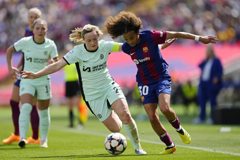 Barcelona's Vicky Lopez, right, vies for the ball with Chelsea's Erin Cuthbert during the women's Champions League semifinals, first leg, soccer match between FC Barcelona and Chelsea FC at the Olympic Stadium, in Barcelona, Spain, Saturday, April 20, 2024. (AP Photo/Jose Breton)