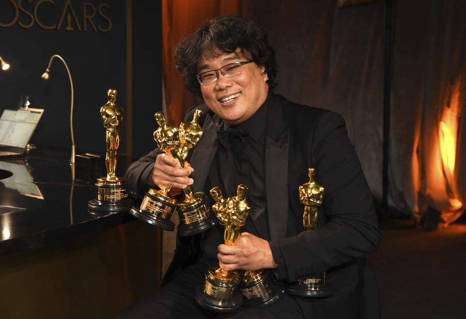 Bong Joon-ho holds the Oscars for best original screenplay, best international feature film, best directing, and best picture for "Parasite" at the Governors Ball after the Oscars on Sunday, Feb. 9, 2020, at the Dolby Theatre in Los Angeles. (Photo by Richard Shotwell/Invision/AP)
