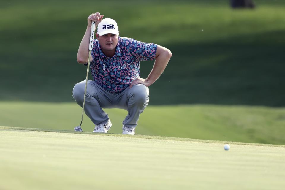 Jason Kokrak lines up a putt on the 18th green during the third round of the Charles Schwab Challenge golf tournament at the Colonial Country Club in Fort Worth, Texas, Saturday May 29, 2021. (AP Photo/Ron Jenkins)