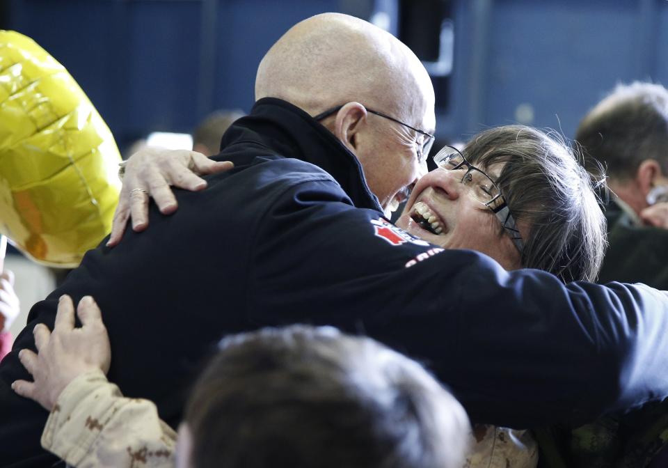 Warrant Officer Josie Swyer hugs her brother Roy Swyer after arriving from Afghanistan, in Ottawa