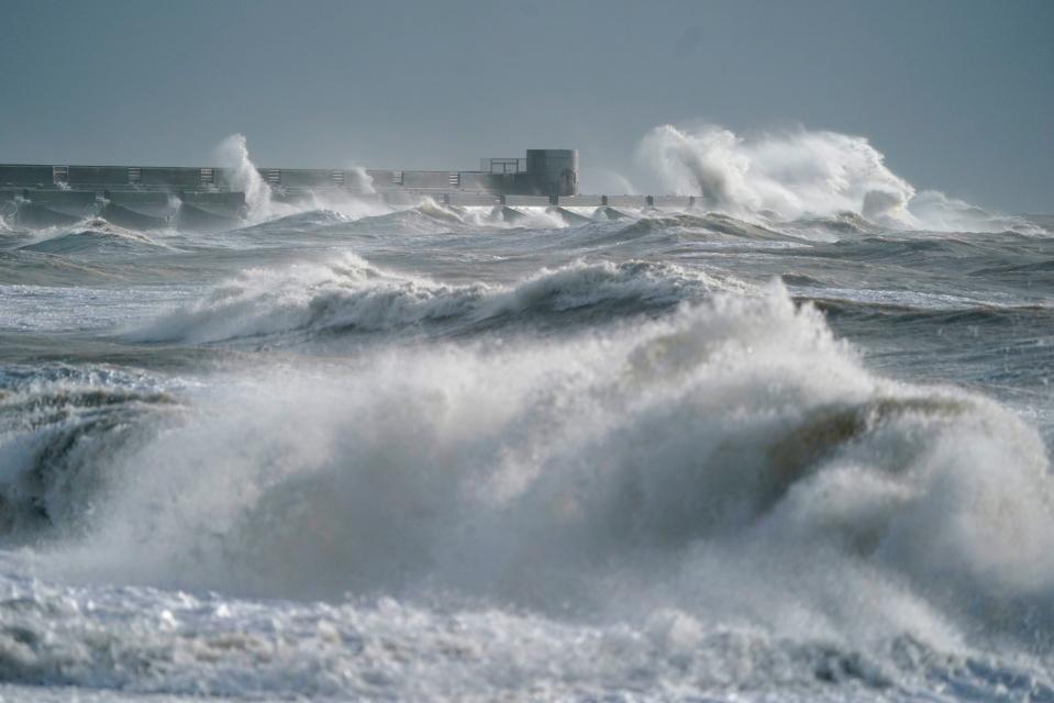 Waves crash in to the shoreline in Brighton, East Sussex. (PA)