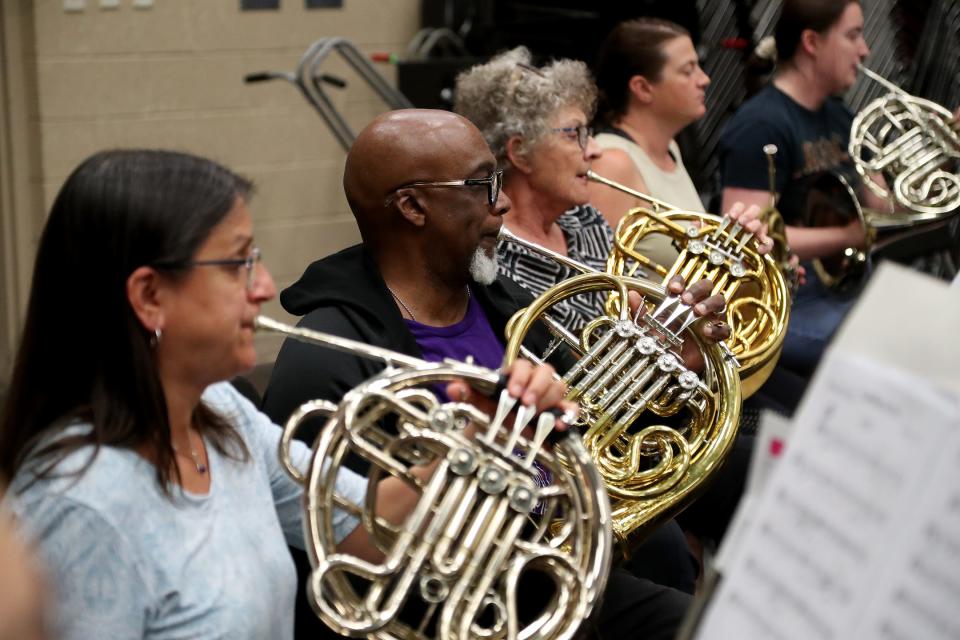 Performers in the French horns section play as the Savannah Wind Symphony rehearses for the upcoming "Let Freedom Ring" Patriotic Concert at Georgia Southern University Armstrong Campus.