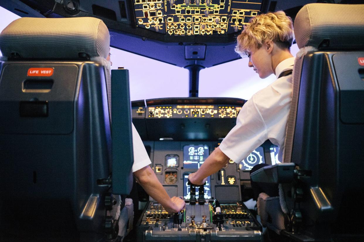 90s airplane cockpit viewed from behind