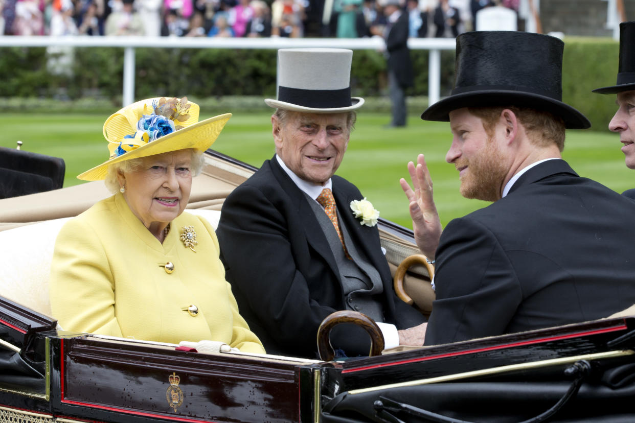 ASCOT, ENGLAND - JUNE 14:  Queen Elizabeth II, and Prince Philip, the Duke of Edinburgh, with Prince Harry, attend the first day of The Royal Ascot race meeting on June 14, 2016 in Ascot, England.(Photo by Julian Parker/UK Press via Getty Images)