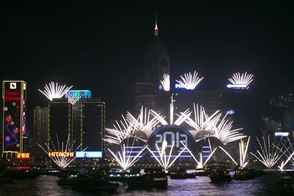 Fireworks light the sky over Victoria Harbour during a pyrotechnic show to celebrate the New Year in Hong Kong January 1, 2013.