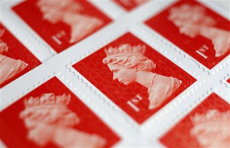 A book of first class postage stamps are seen in detail in Manchester, northern England, September 12, 2013. REUTERS/Phil Noble