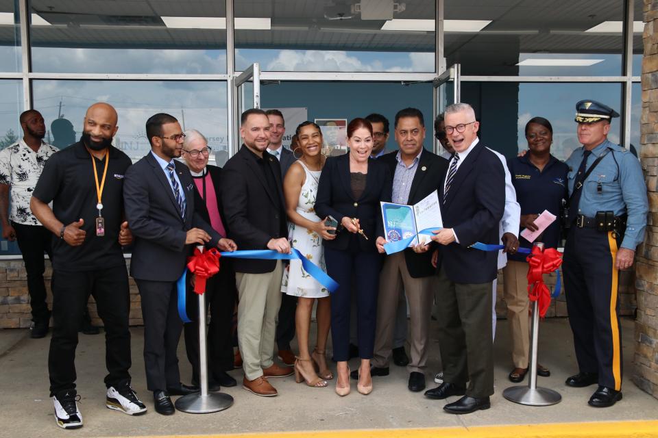 Assemblywoman Yvonne Lopez, D-19th District next to former New Jersey Gov. Jim McGreevey cuts the ribbon on New Jersey Reentry Corporation's new Middlesex County facility in Carteret