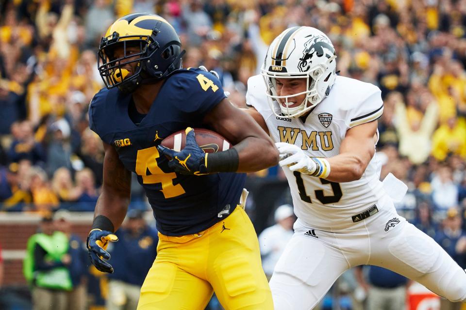 Michigan receiver Nico Collins scores a touchdown past Western Michigan defensive back Harrison Taylor in the first half at Michigan Stadium on Sept. 8, 2018, in Ann Arbor.