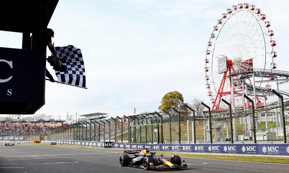 <span>Max Verstappen passes the chequered flag to win the Japanese Grand Prix at Suzuka.</span><span>Photograph: Kim Kyung-Hoon/EPA</span>