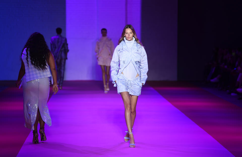 A model walks the runway at the Brandon Maxwell spring/summer 2022 fashion show in the Brooklyn borough of New York during Fashion Week on Friday, Sept. 10, 2021. (Photo by Evan Agostini/Invision/AP)