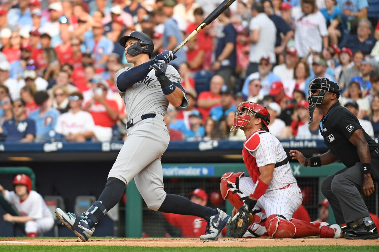 Jul 29, 2024; Philadelphia, Pennsylvania, USA; New York Yankees outfielder Aaron Judge (99) watches his home run against the Philadelphia Phillies during the first inning at Citizens Bank Park. Mandatory Credit: Eric Hartline-USA TODAY Sports