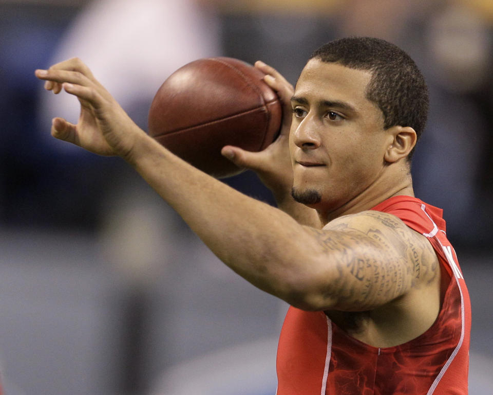 Colin Kaepernick runs a drill during the NFL football scouting combine in Indianapolis, Feb. 27, 2011. - Credit: Darron Cummings/AP