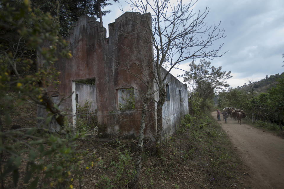 In this March 6, 2014 photo, the ruins of the Bethesda Christian Church stand by the wayside of the uninhabited village El Aguacate in San Andres Itzapa, Guatemala. In November 1988 in the mountainous area of western Guatemala, 22 men who lived in the village of El Aguacate where massacred by leftists guerillas during the Guatemalan civil war. The case will be taken to court on Thursday, March 13, 2014, in which more than 30 persons are expected to testify. (AP Photo/Luis Soto)