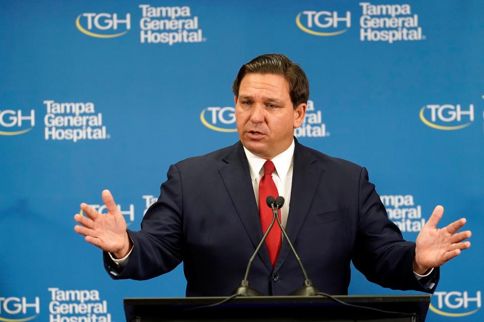 Florida Gov. Ron DeSantis speaks to the media after watching the Pfizer-BioNTech COVID-19 vaccine delivered Monday, Dec. 14, 2020, at Tampa General Hospital in Tampa, Fla.